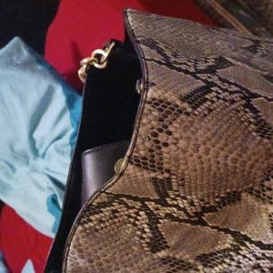 A snake skin  Liz Claiborne purse It's Grey and in excellent shape!